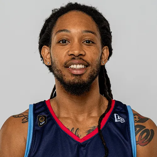 Professional headshot of Sherwood Brown smiling in a navy team jersey